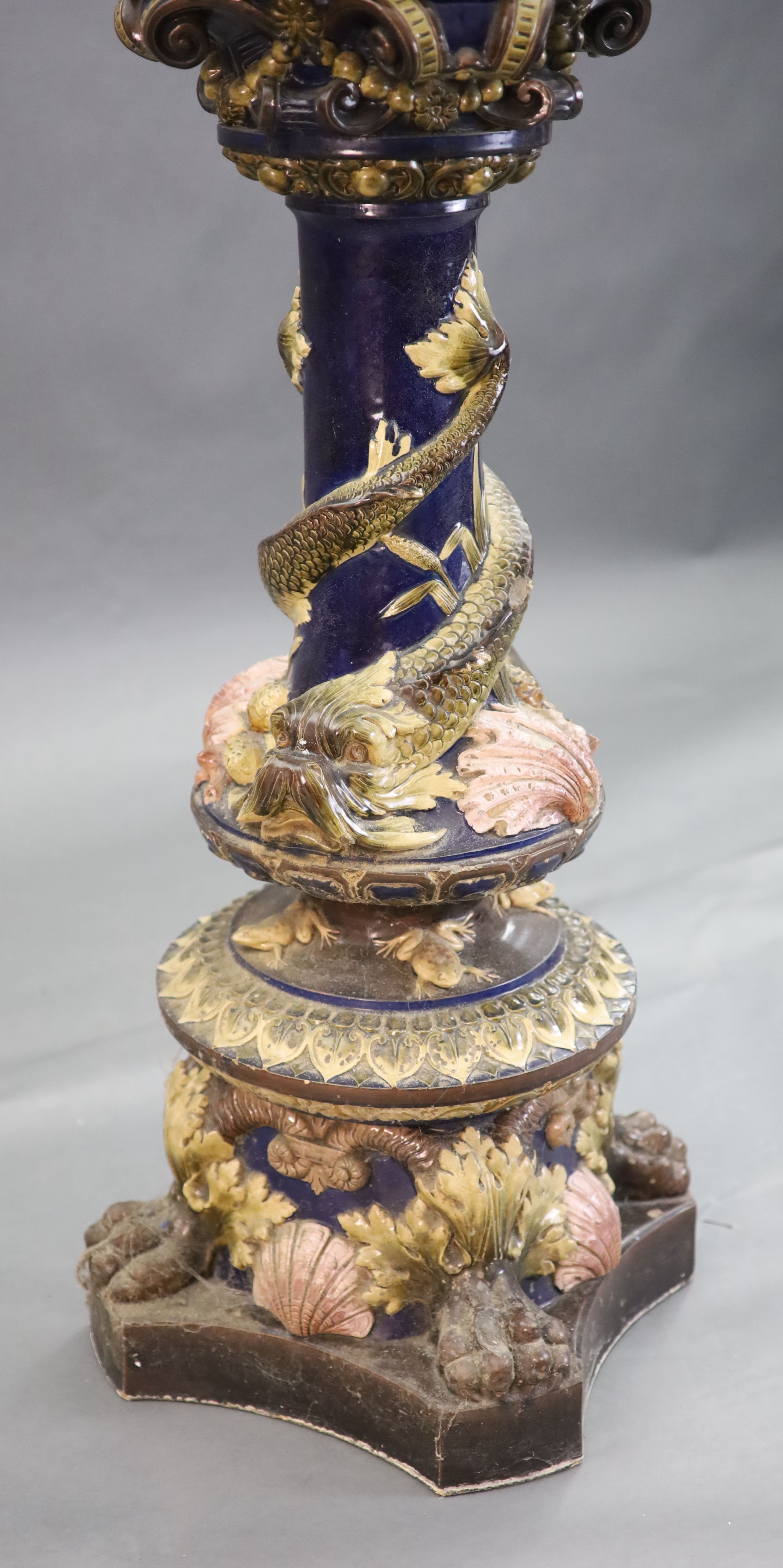 A Continental Palissy style grotesque pottery jardiniere and associated pedestal, late 19th century, total height 134cm